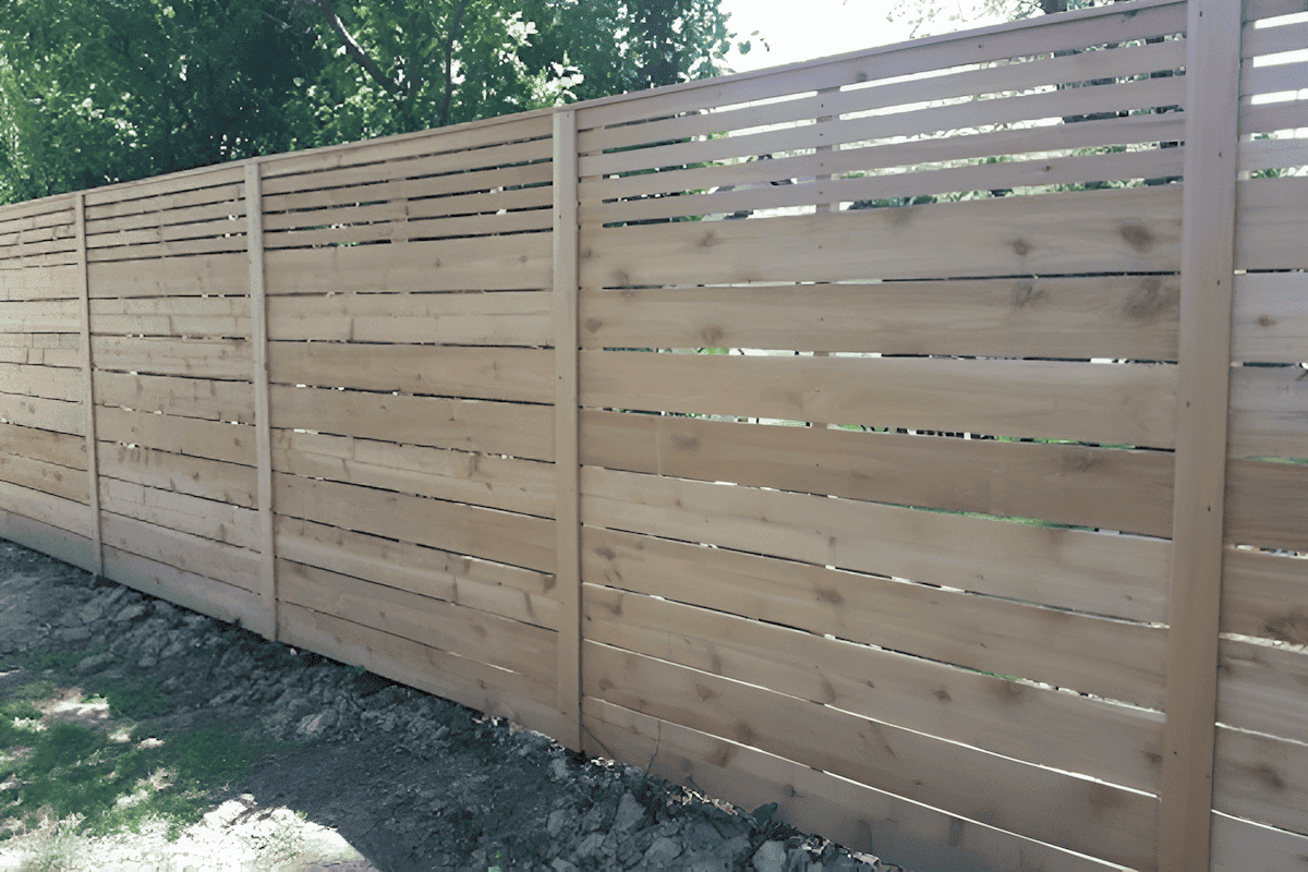 horizontal wood lattice privacy screen around a patio