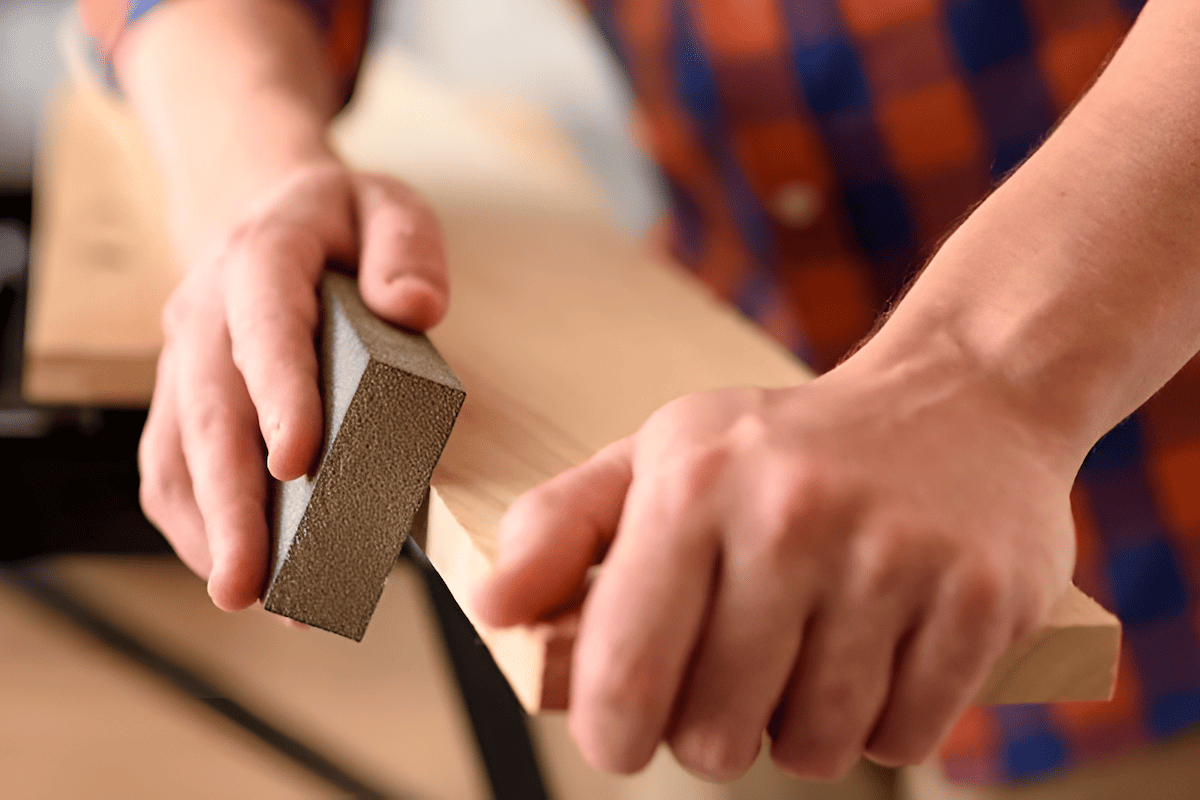 sanding wood to prepare wood for a wood finish