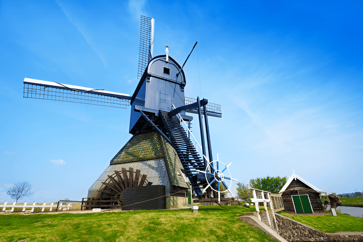 wood windmill pumping water